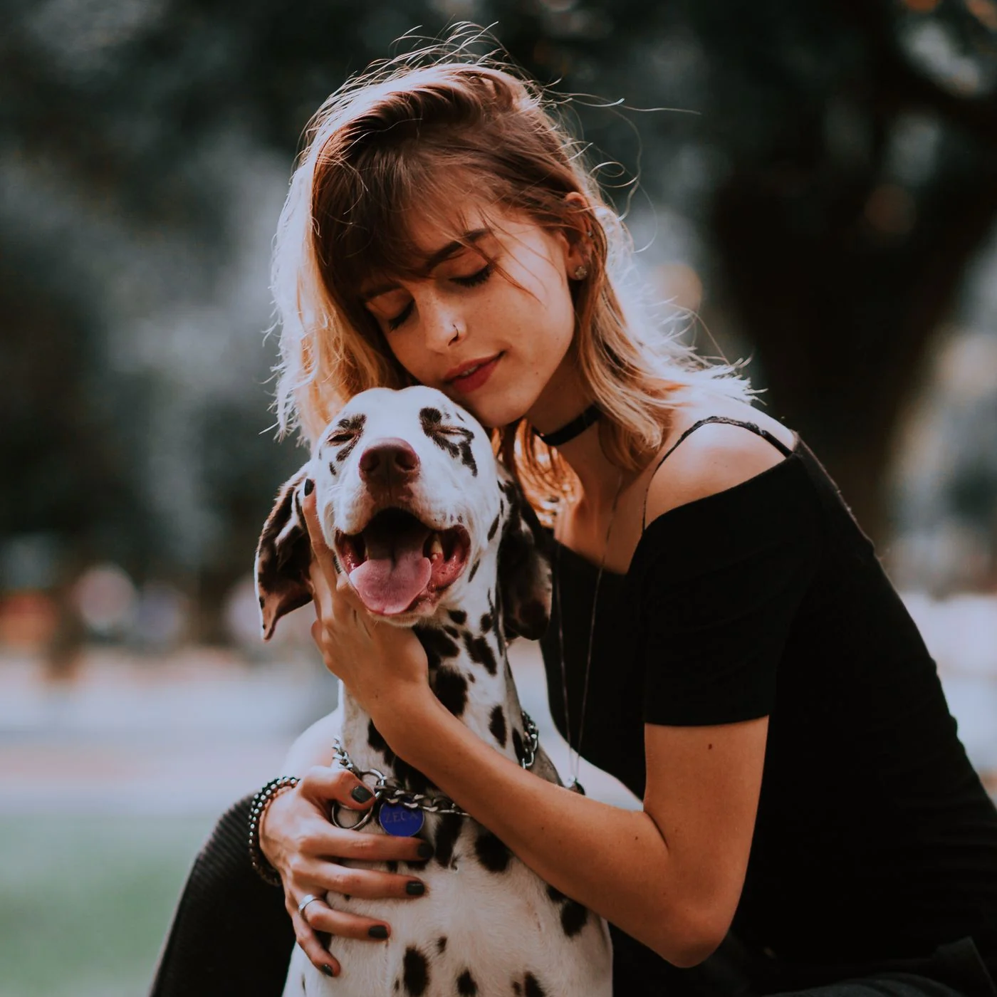 Person spending time outdoors with a dog